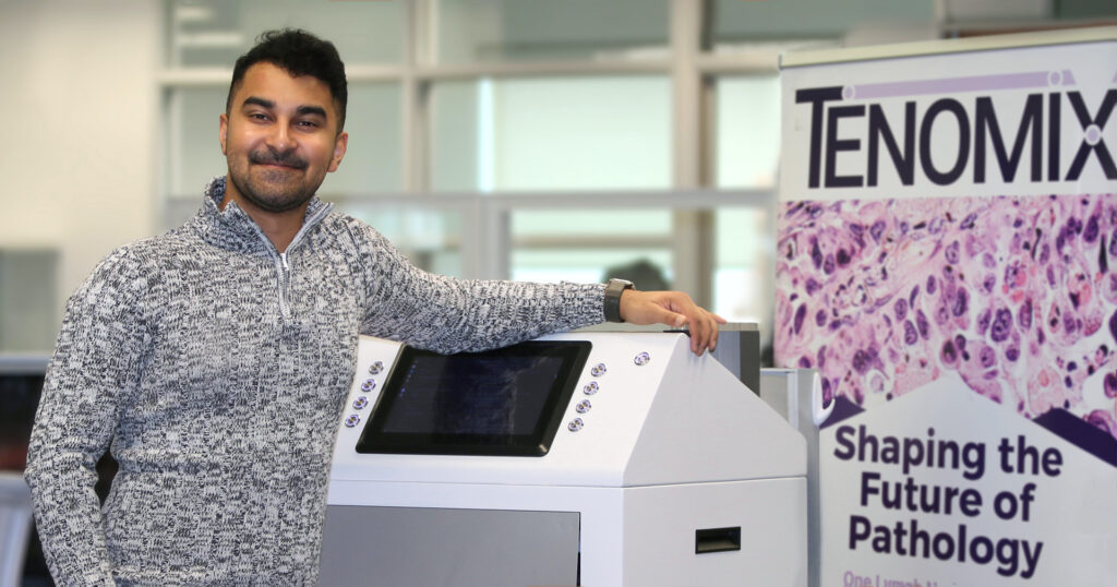 Saumik Biswas, CEO of Tenomix, showing the robotic scanner his company developed and is bringing to market with support from Western's Technology Transfer Office